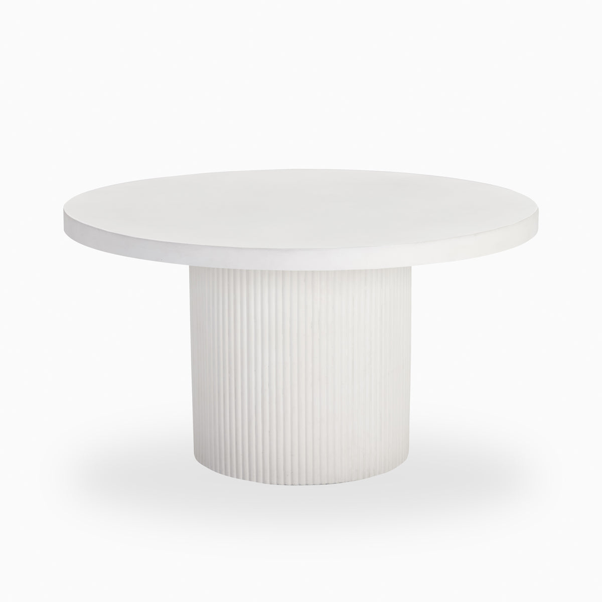 White round outdoor dining table with a smooth circular top, thick beveled edge, and fluted cylindrical pedestal base in a matte stone-like finish.