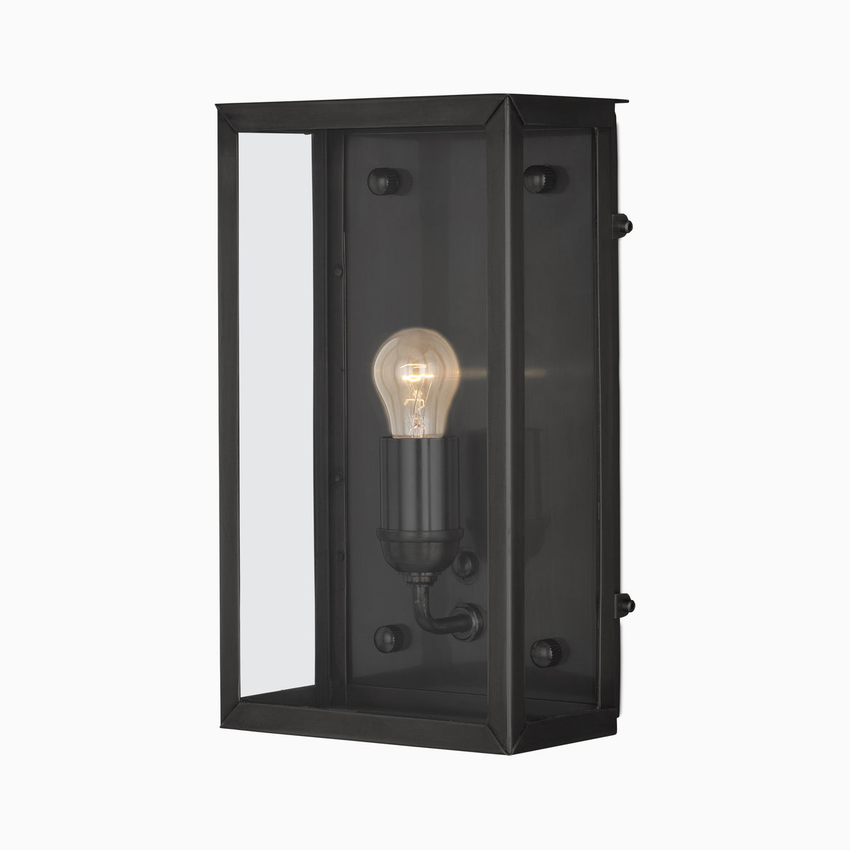 Black metal wall lantern with a beveled rectangular frame, clear glass panels, smoky interior, visible glowing bulb, and matte black finish on a plain white background.
