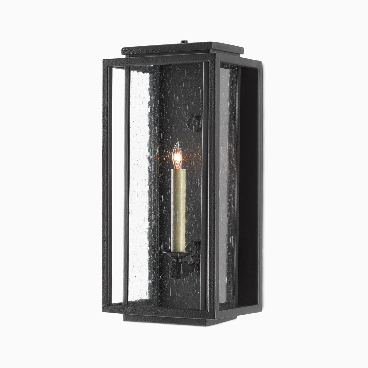 Black rectangular wall sconce with seeded glass panels and a single candle-style light on a plain white background.