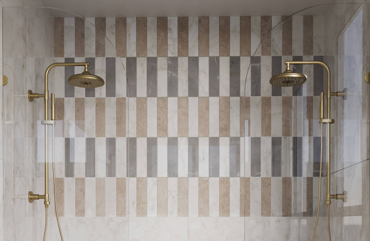 Shower wall featuring vertically stacked 3x12 subway tiles in a mix of white, taupe, and gray marble-look finishes, arranged in alternating bands that create a rhythmic striped pattern,