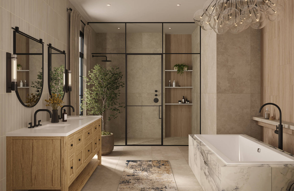Elegant bathroom with taupe tile walls, wood vanity, arched mirrors, marble look tub surround, and glass shower framed in black metal.