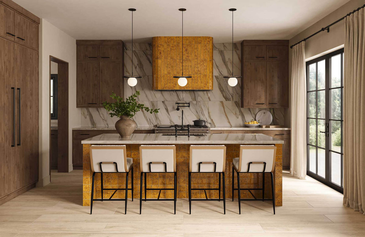 Contemporary kitchen with dramatic marble-look backsplash walls, warm wood cabinetry, waterfall island, and golden textured range hood surround beneath pendant lighting