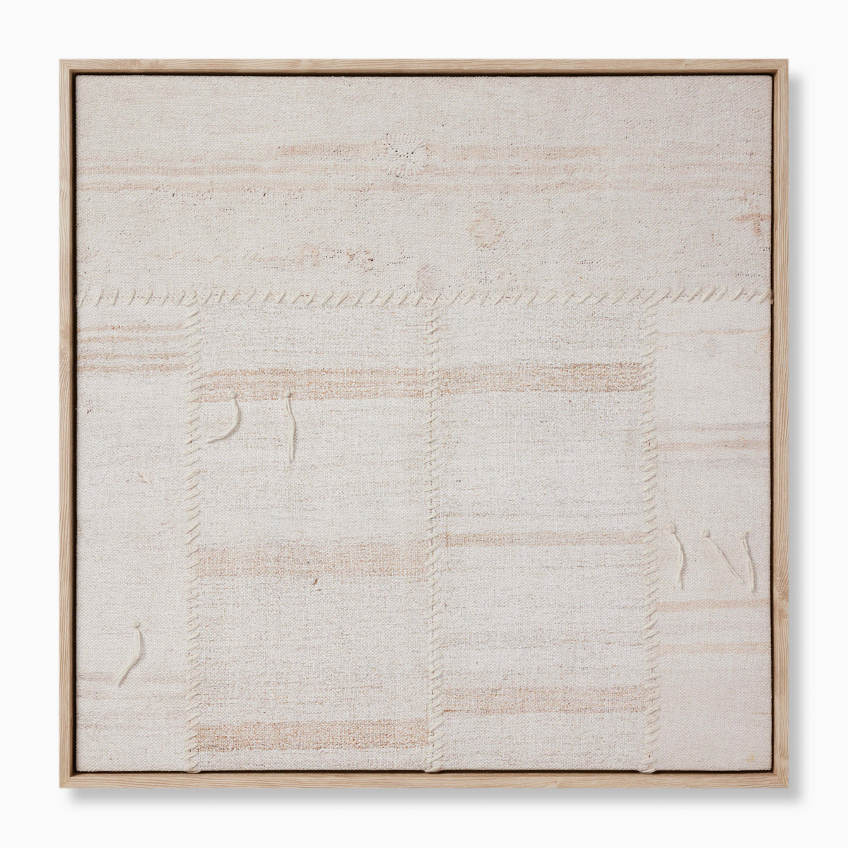 Framed textile artwork in soft neutral tones with visible stitched seams and subtle texture, evoking a handwoven, artisanal feel.
