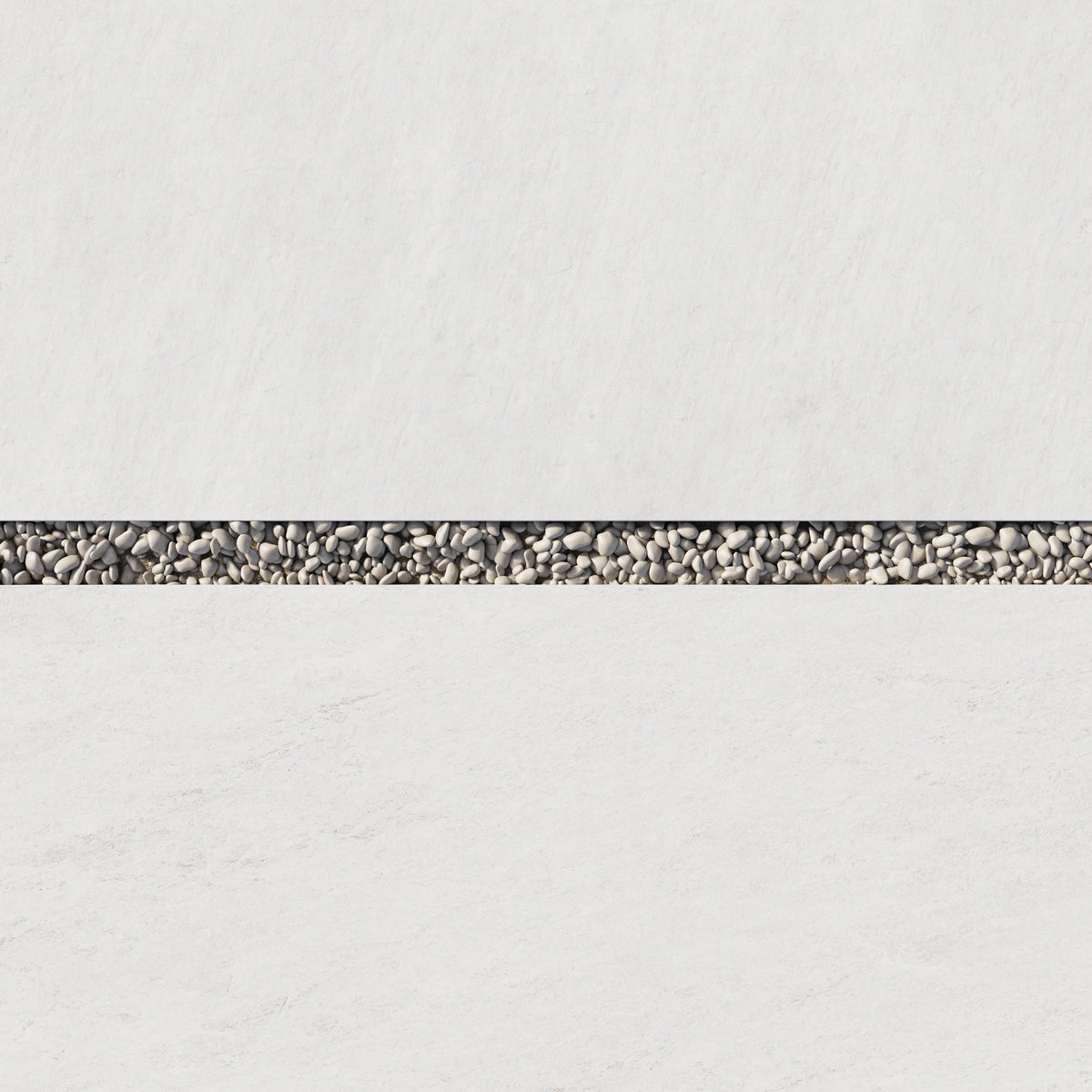 Detailed view of Carter Ash 24x48 Matte Pavers, 2cm thick, highlighting the smooth white finish paired with decorative grey pebbles.