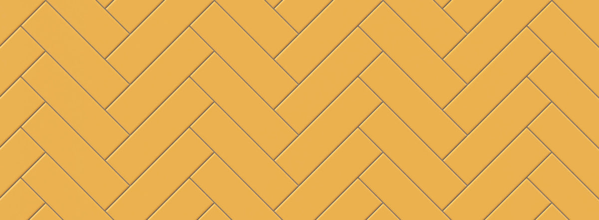 Bright yellow tiles arranged in a herringbone pattern, bringing a vibrant and dynamic energy to any kitchen wall