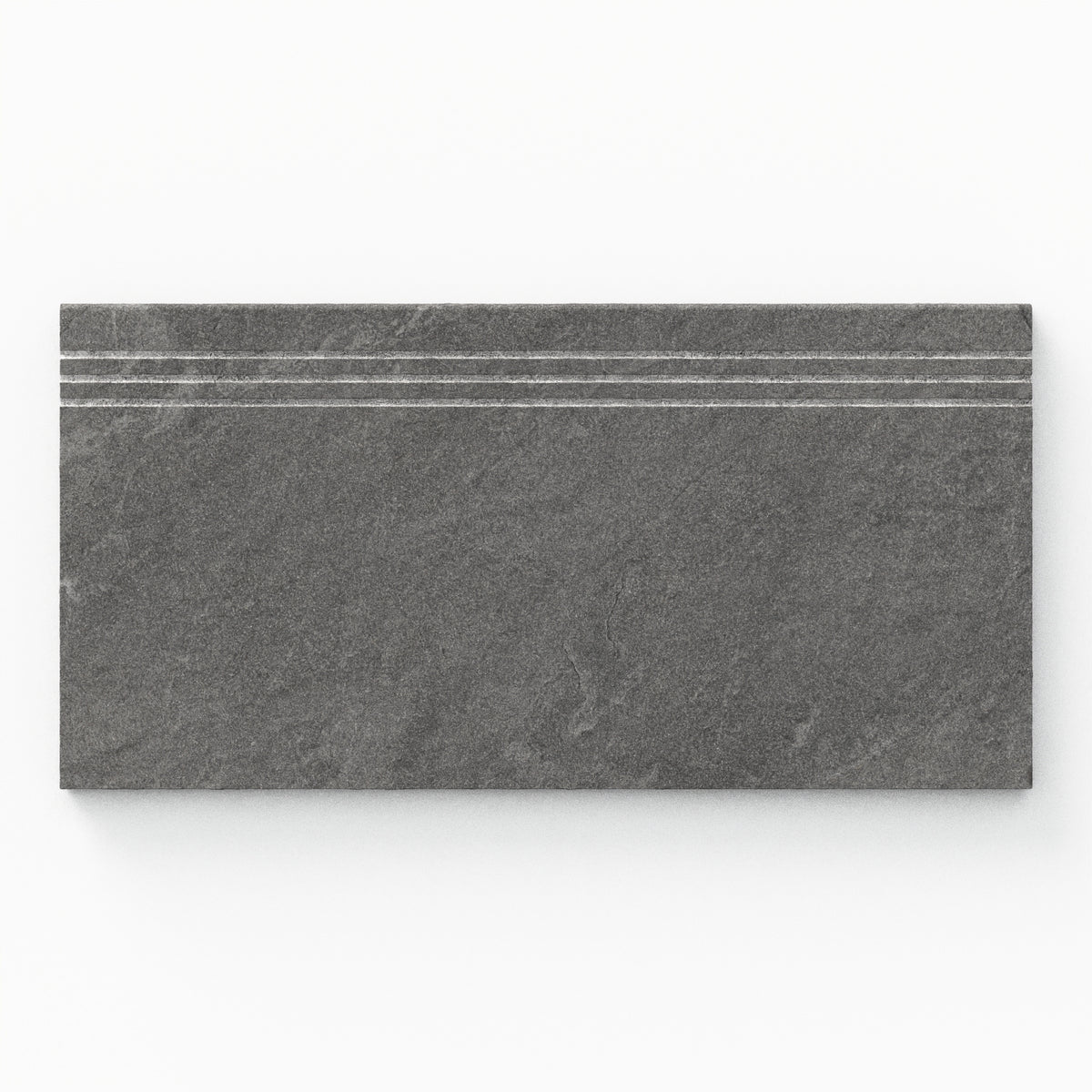 Bowden 12x24 Grip Porcelain 2cm Coping / Stair Tread in Charcoal, showcasing a rich dark gray finish for a bold outdoor aesthetic.