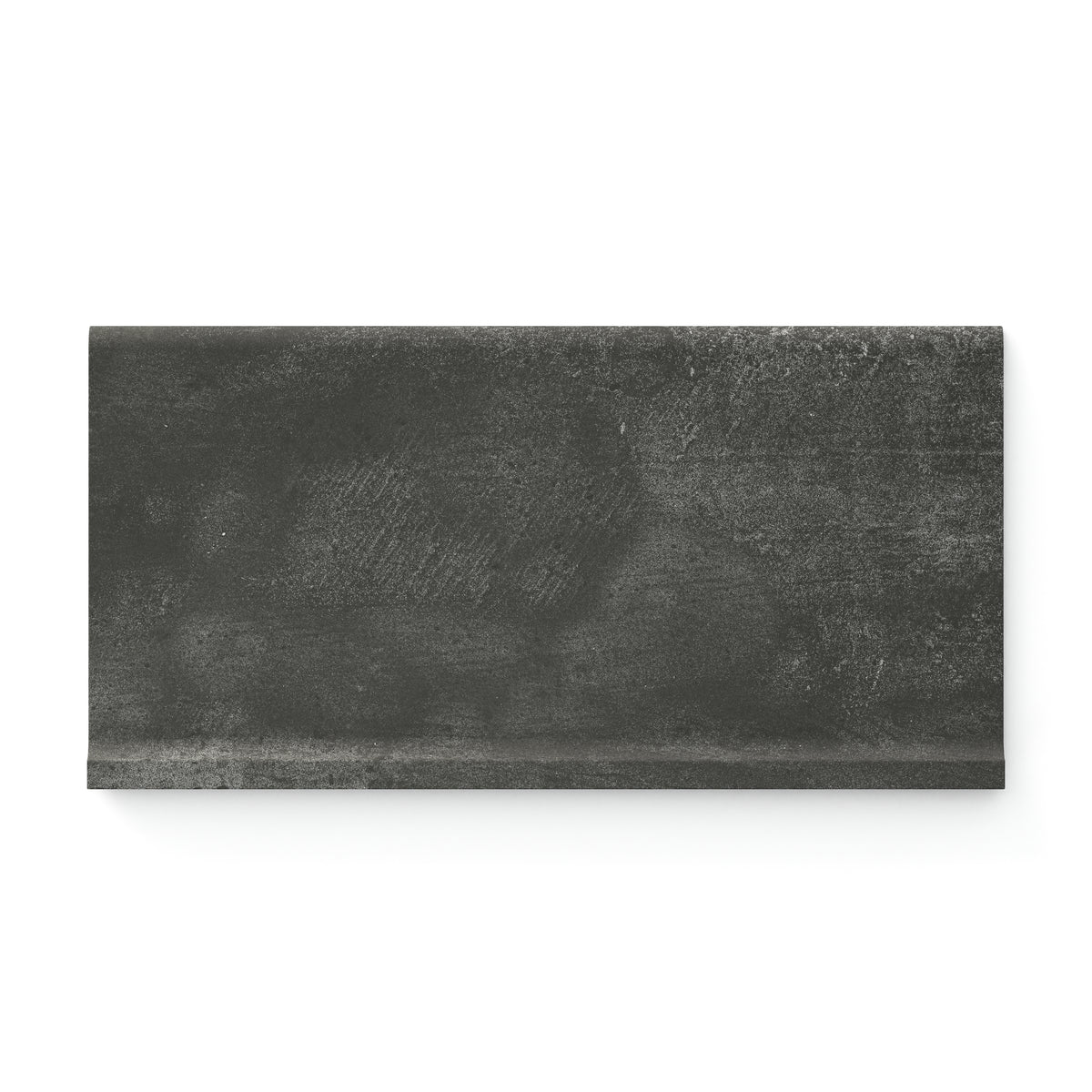 Ramsey 6x12 matte cove base tile, showcasing a rich dark gray tone with subtle concrete texture for modern elegance