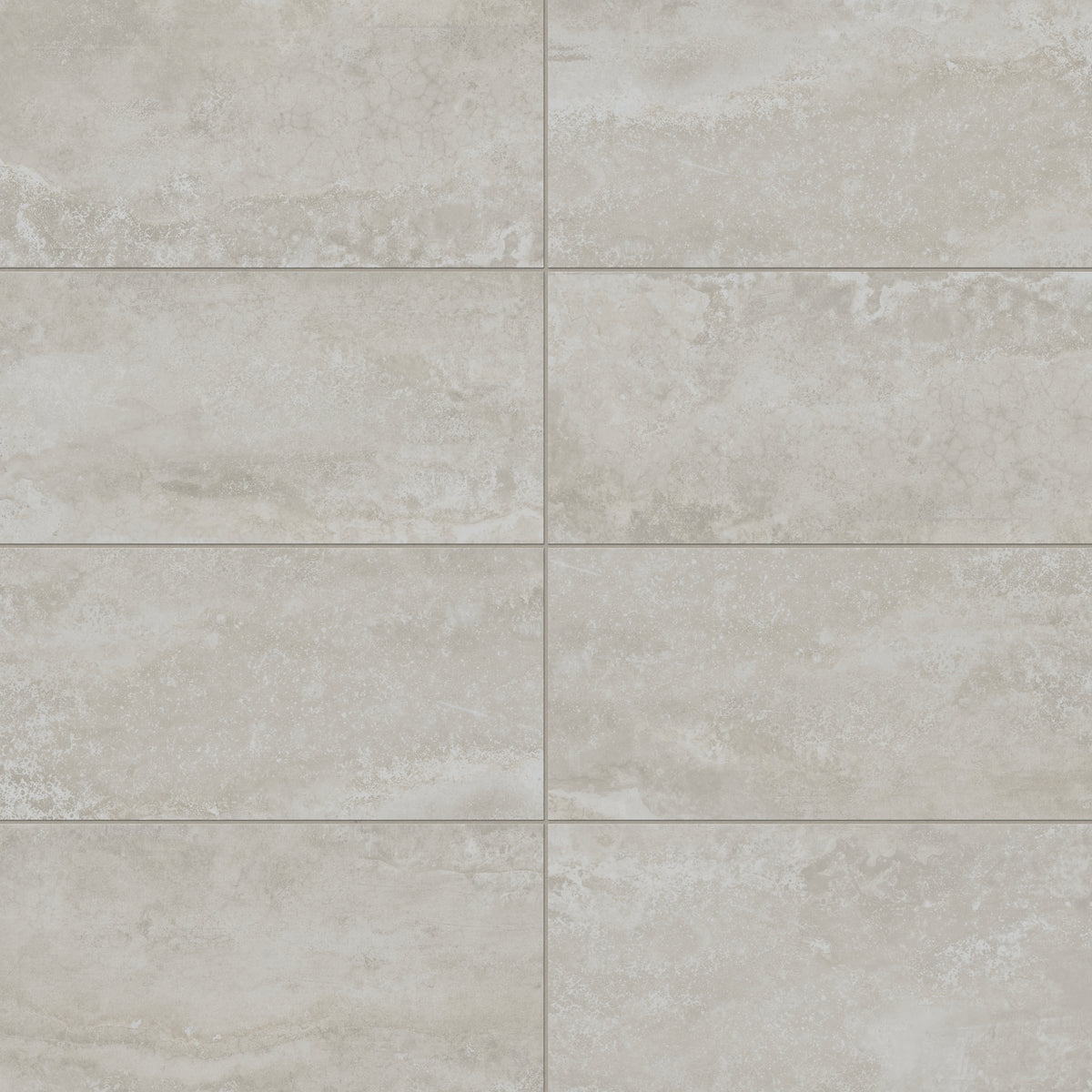 Soft taupe industrial-style 12x24 matte porcelain tiles with subtle stone textures, perfect for contemporary or minimalist spaces