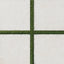 Bowden Canvas 24x24 2CM Grip tile in a light cream tone, paired with vibrant green turf for a modern outdoor aesthetic.