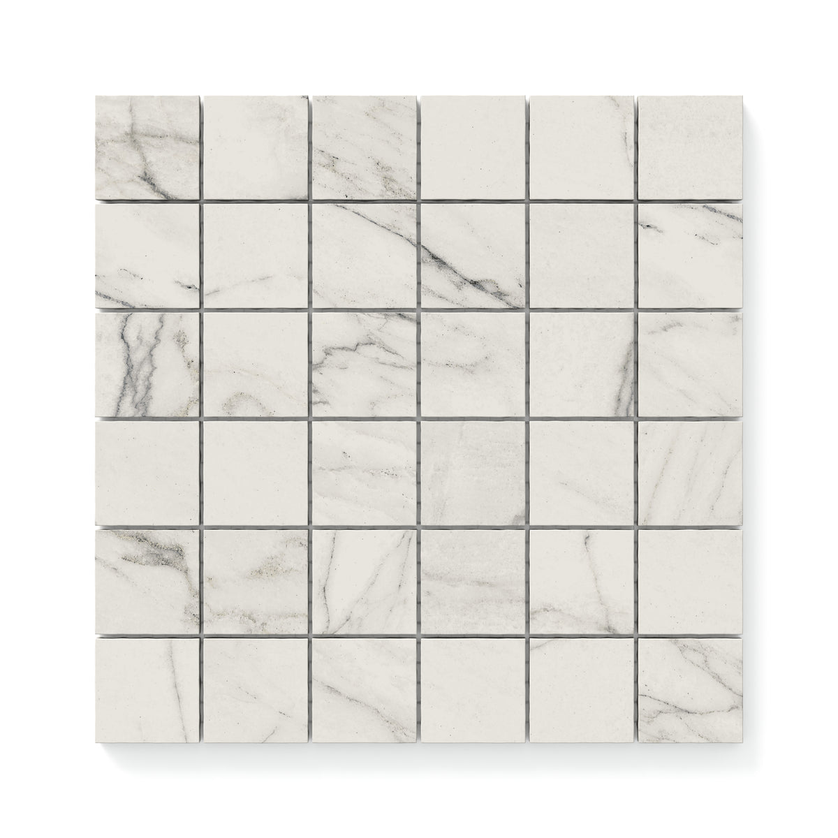 Close-up of 2x2 matte Calacatta marble look mosaic tiles, showcasing light grey veining and a timeless, elegant design perfect for modern interiors.