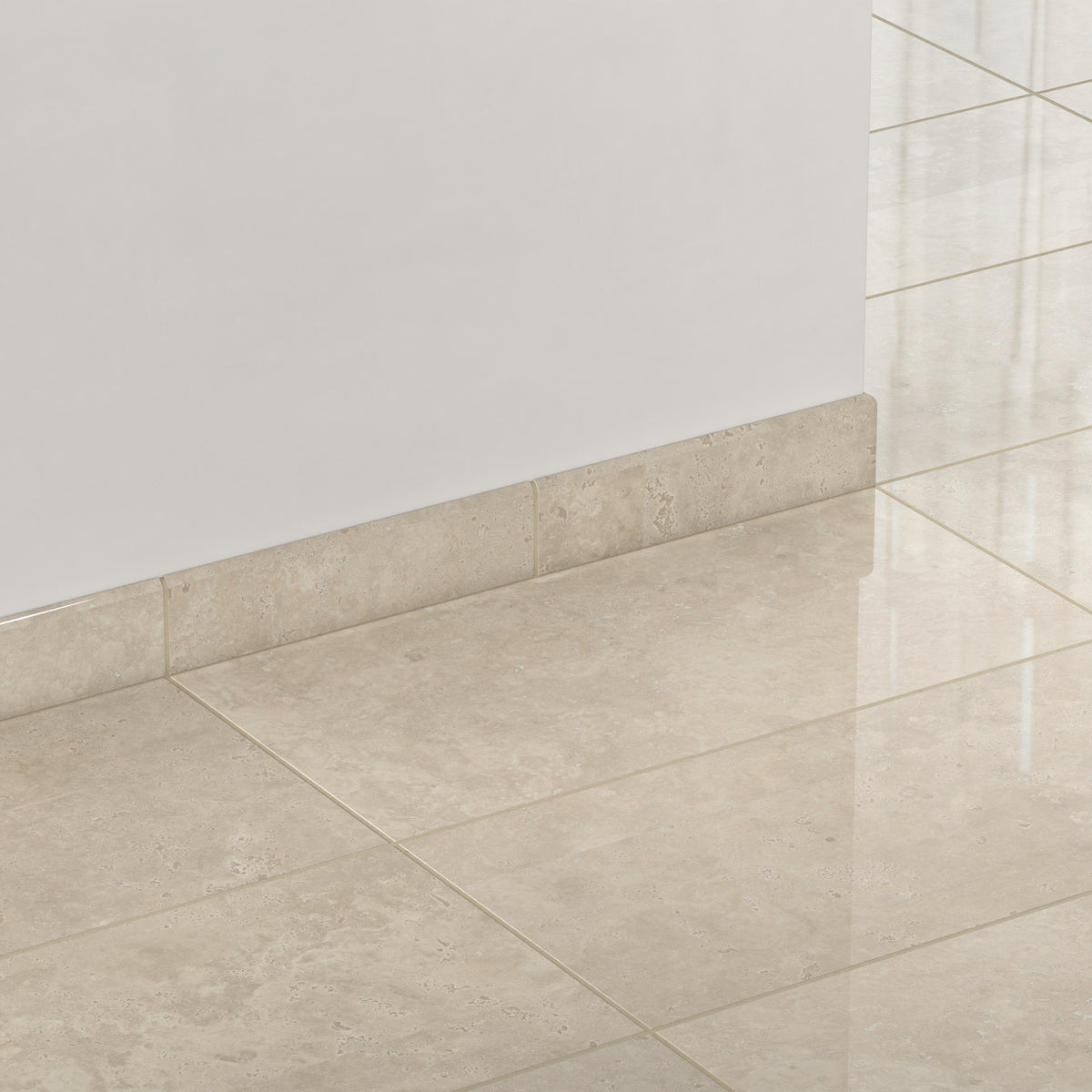 Leona Marfil 3x12 bullnose tile with a polished finish frames the floor edges, seamlessly blending with matching beige floor tiles.