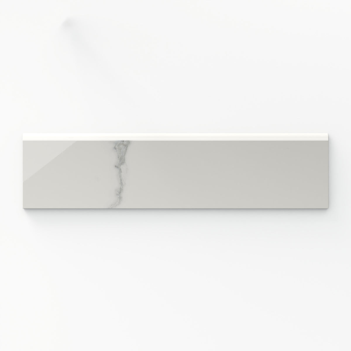 Leona Calacatta 3x12 bullnose tile in a polished finish, showcasing a soft white marble look with delicate gray veining.