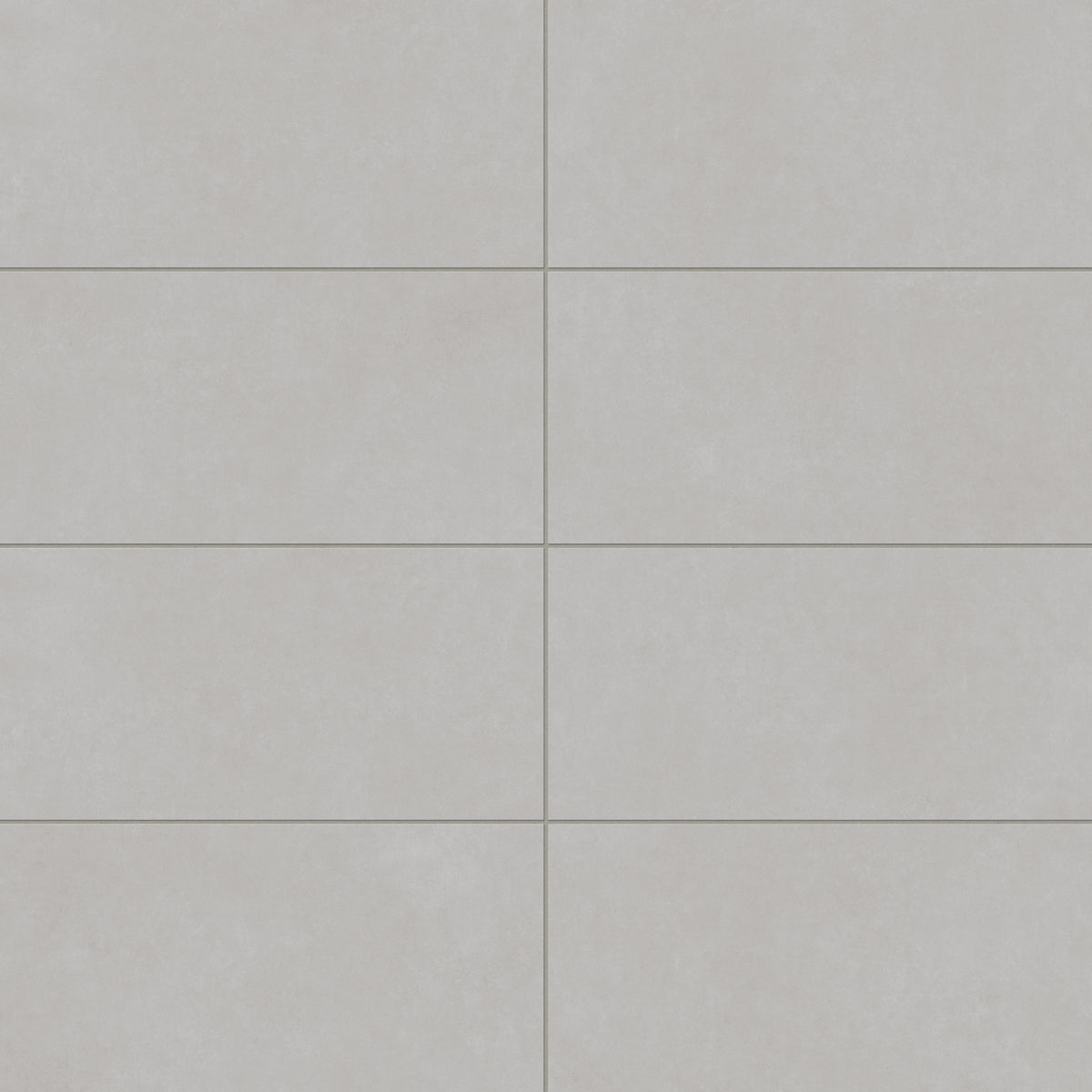Wyatt Fog 12x24 matte porcelain tiles, featuring a soft gray tone with subtle variation, ideal for creating sleek and timeless interiors.