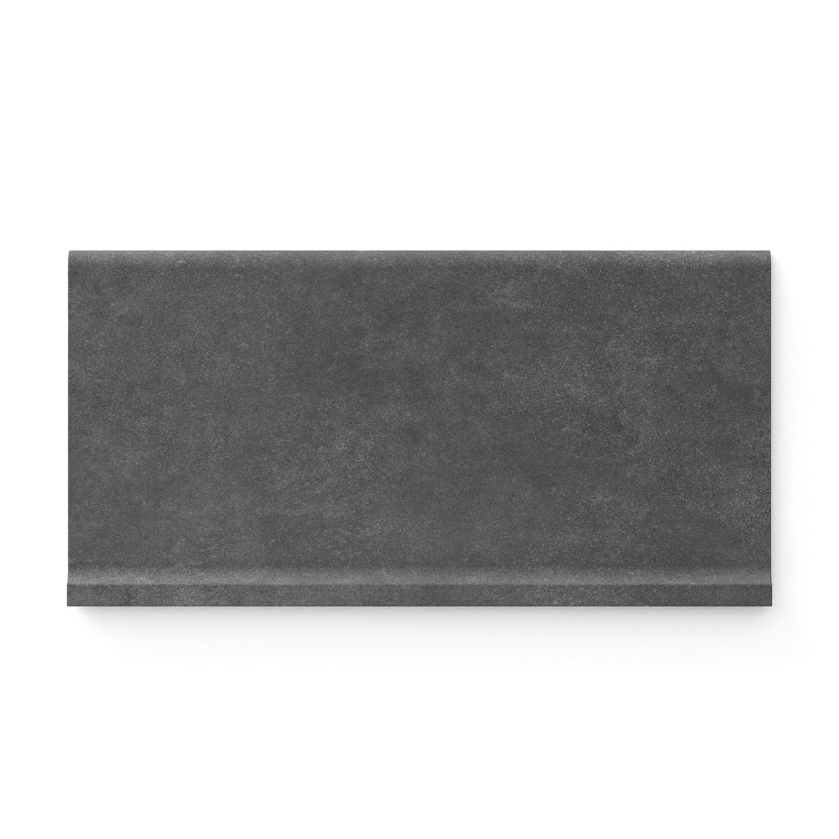 Bold iron-toned Wyatt 6x12 matte porcelain cove base tiles, delivering a dramatic, textured finish for striking and modern interiors.