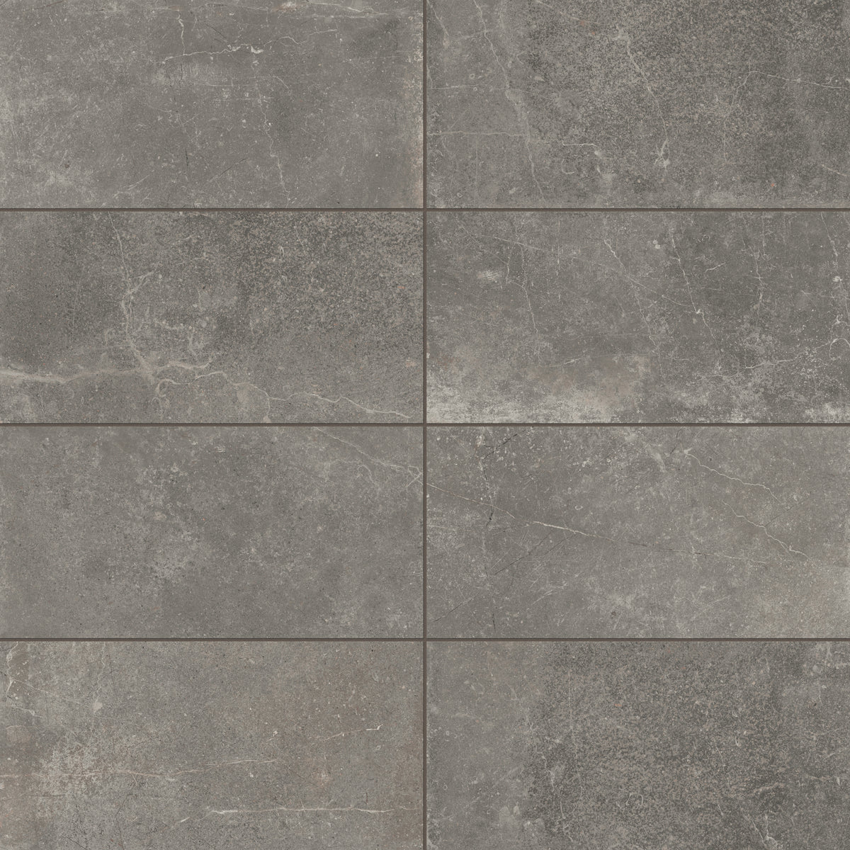 Rich 12x24 matte porcelain tiles in deep smoky gray tones, highlighted with natural veining for a bold and contemporary design.