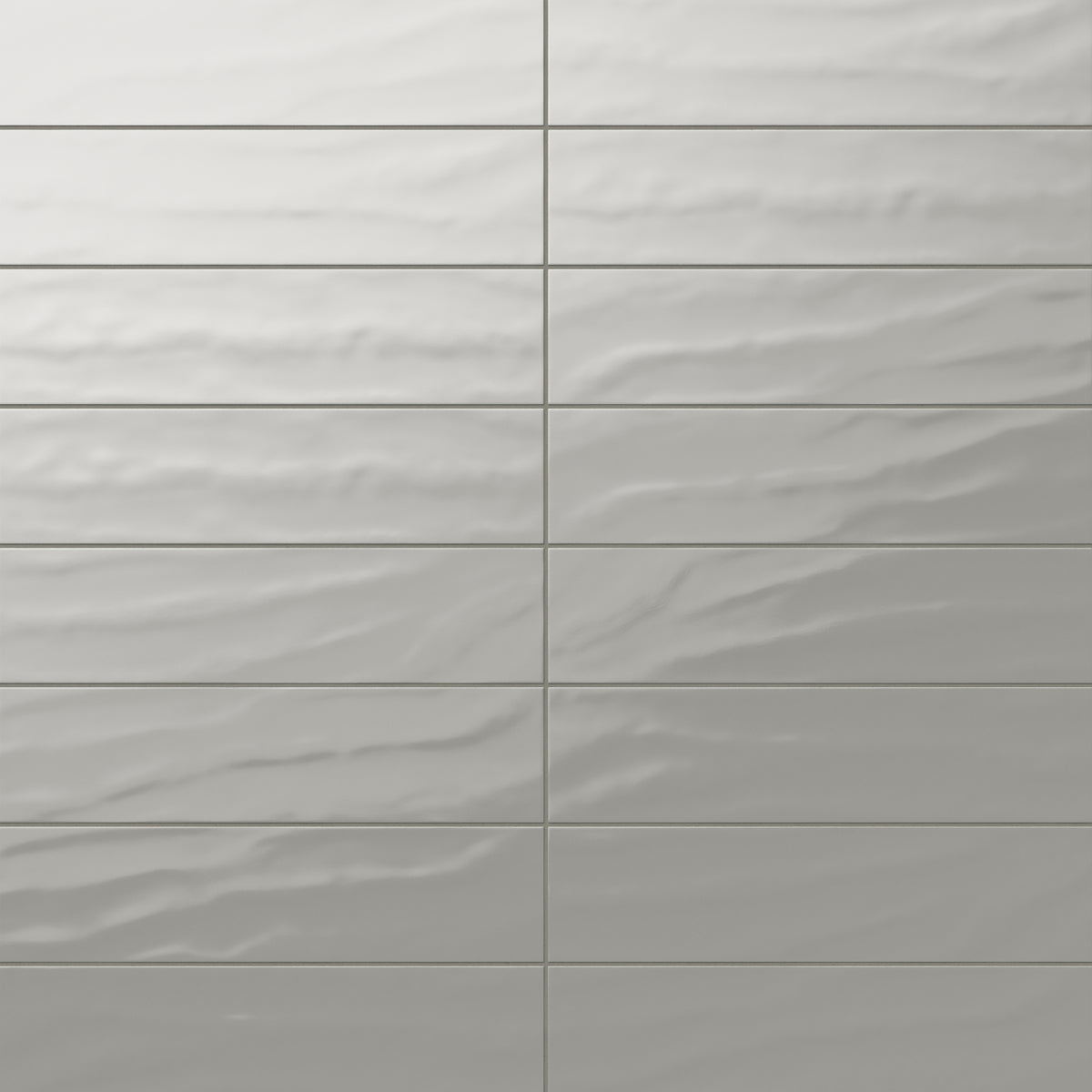 Palmer 6x24 glossy porcelain tile in olive, showcasing a smooth wavy texture with a soft greenish-grey sheen.