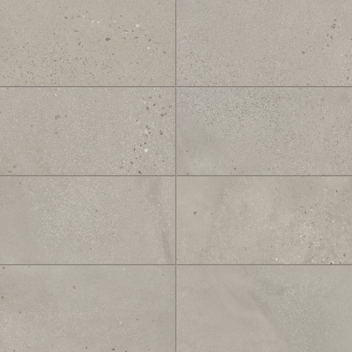 Sloane 12x24 matte porcelain tile in Sandstone, showcasing a soft beige tone with speckled accents, perfect for warm, neutral interior designs.