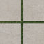 Dawson 24x24 Grip Porcelain 2cm Paver Tile in Dune, displayed with grass joints to highlight its warm, natural tone and textured surface.