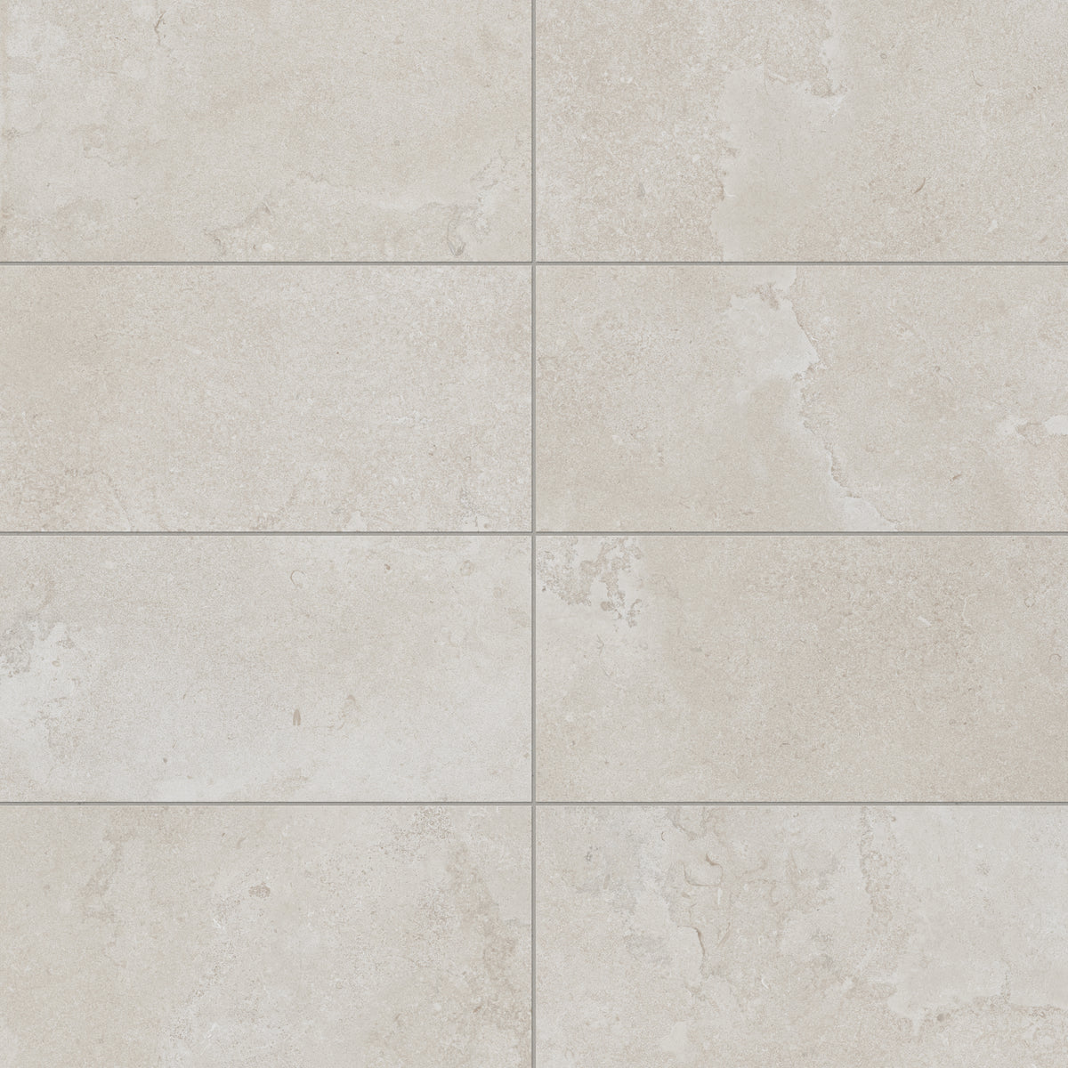 Soft 12x24 matte porcelain tile in a warm beige hue with cross-cut details, creating a natural stone-inspired aesthetic ideal for timeless interiors.