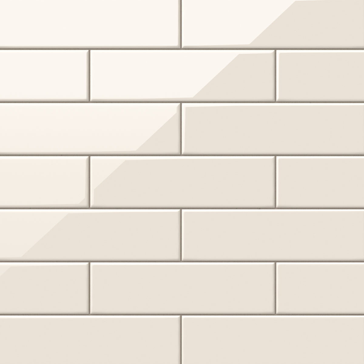Polly Cream 3x10 glossy ceramic tiles offer a warm, sophisticated tone with a smooth reflective finish, perfect for creating timeless backsplashes or elegant bathroom walls.