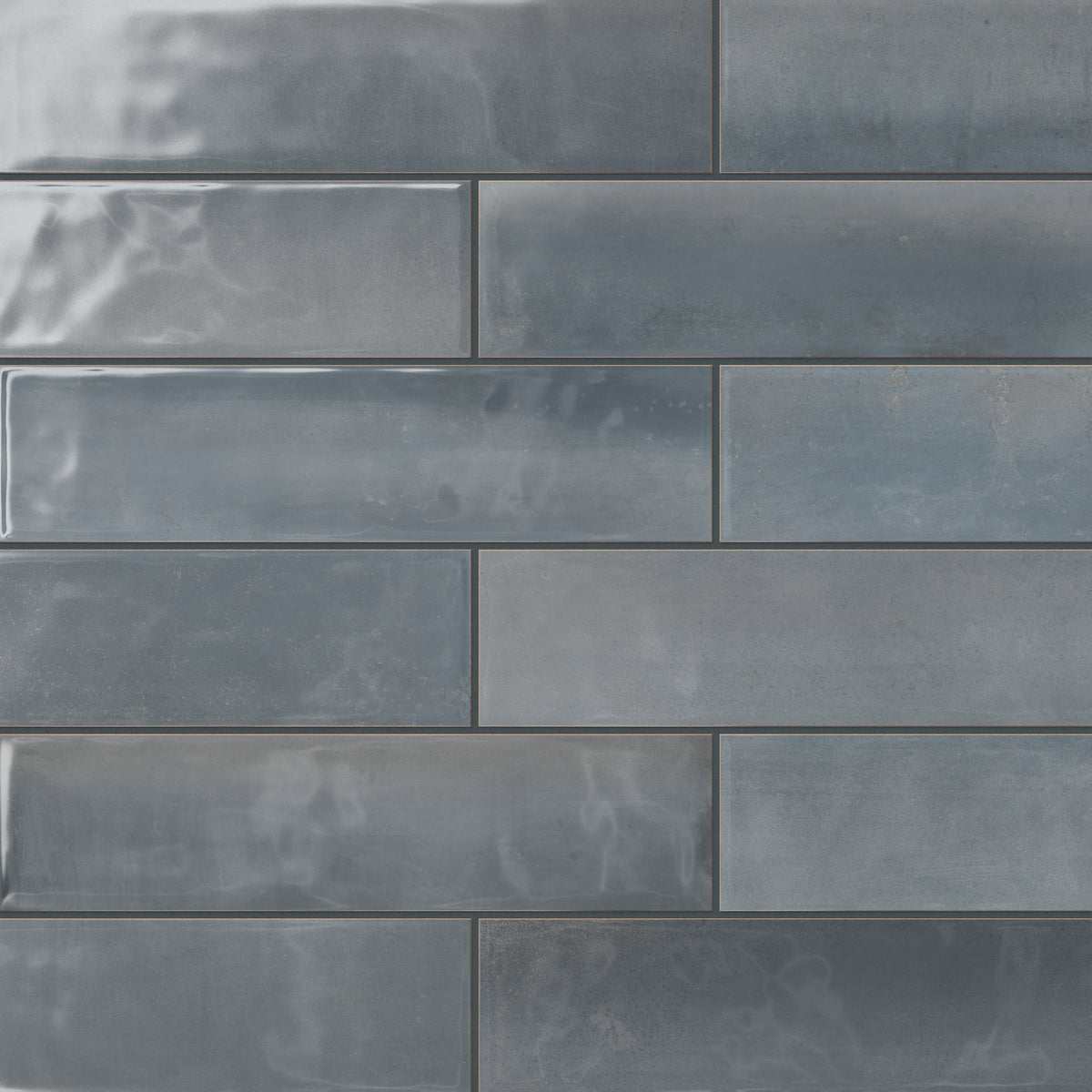 A sleek reflective surface and deep blue tones make these glossy 4x16 subway tiles a perfect choice for adding serenity and sophistication to modern interiors.