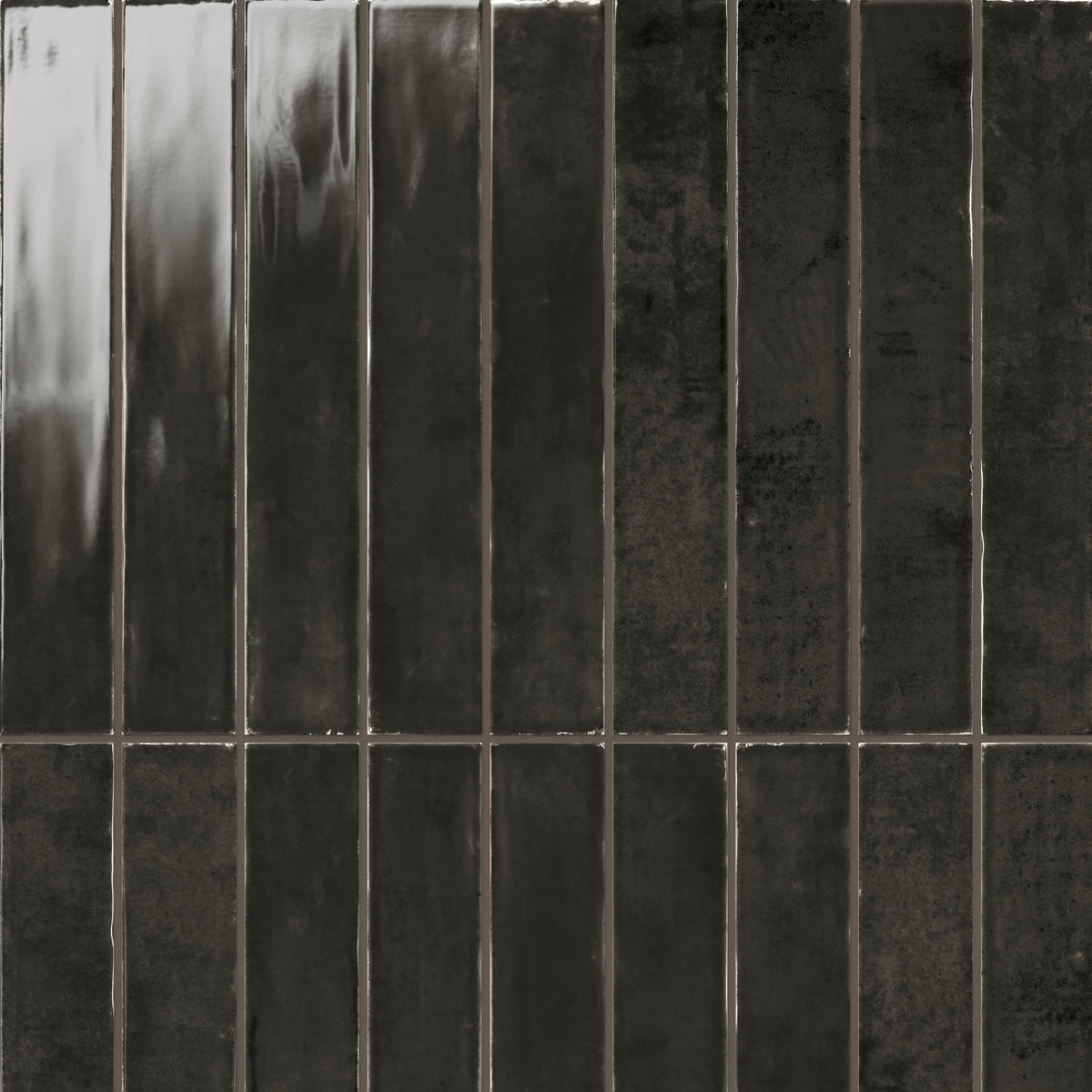 Deep charcoal gloss tile in a sleek 2.5x16 size, offering a polished, modern aesthetic with subtle texture for versatile wall designs.