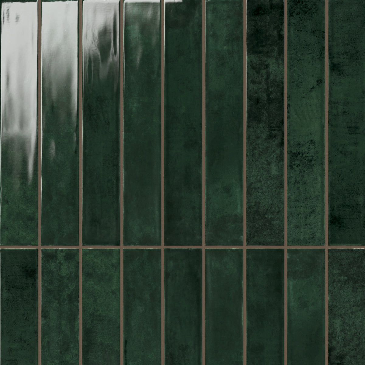 Deep forest green Jaden Hunter 2.5x16 glossy ceramic tiles, featuring a rich, reflective surface and subtle tonal variations for a dramatic and luxurious design statement.