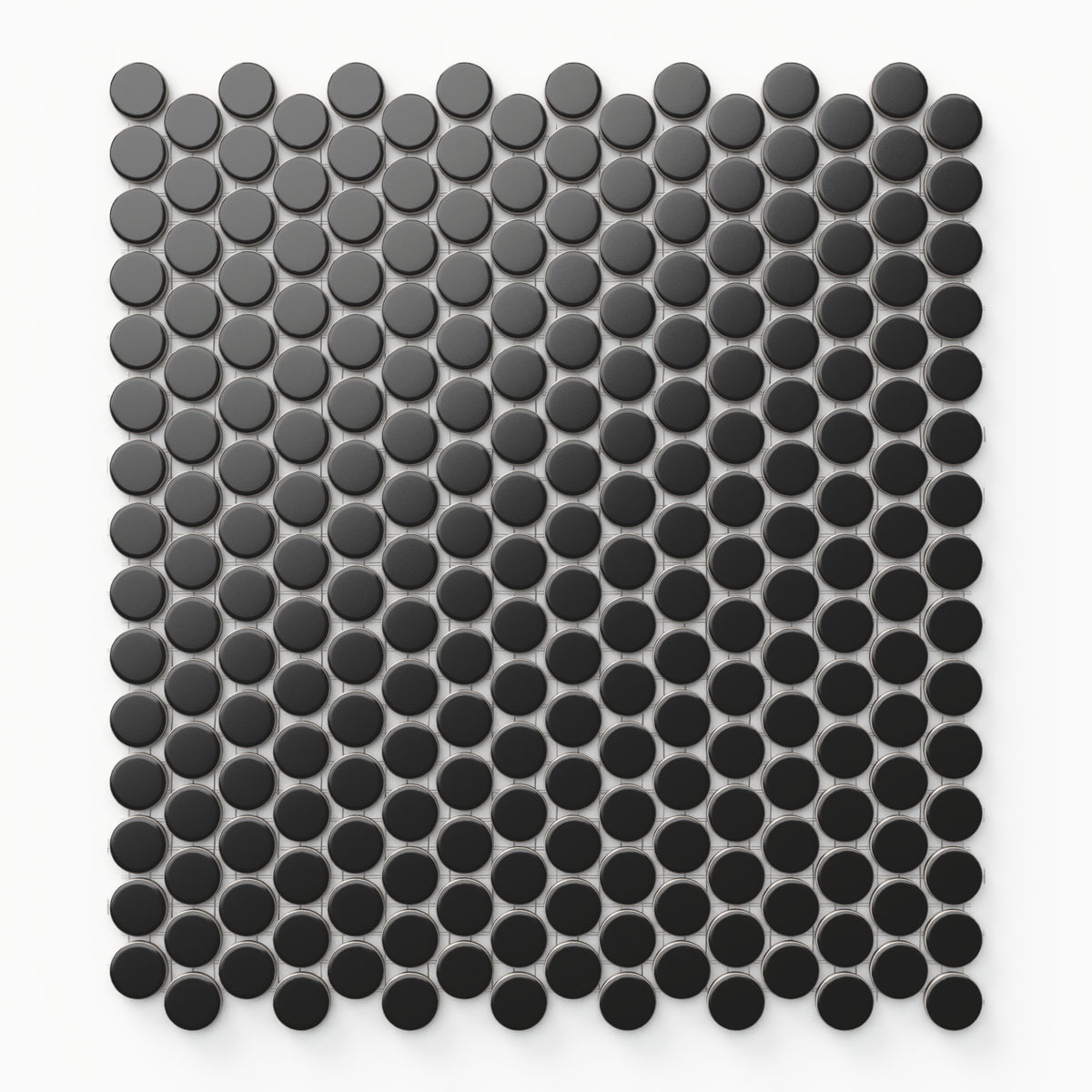 These 12x12 matte black penny round tiles form a smooth mosaic pattern, creating a bold, modern look with an air of timeless elegance.