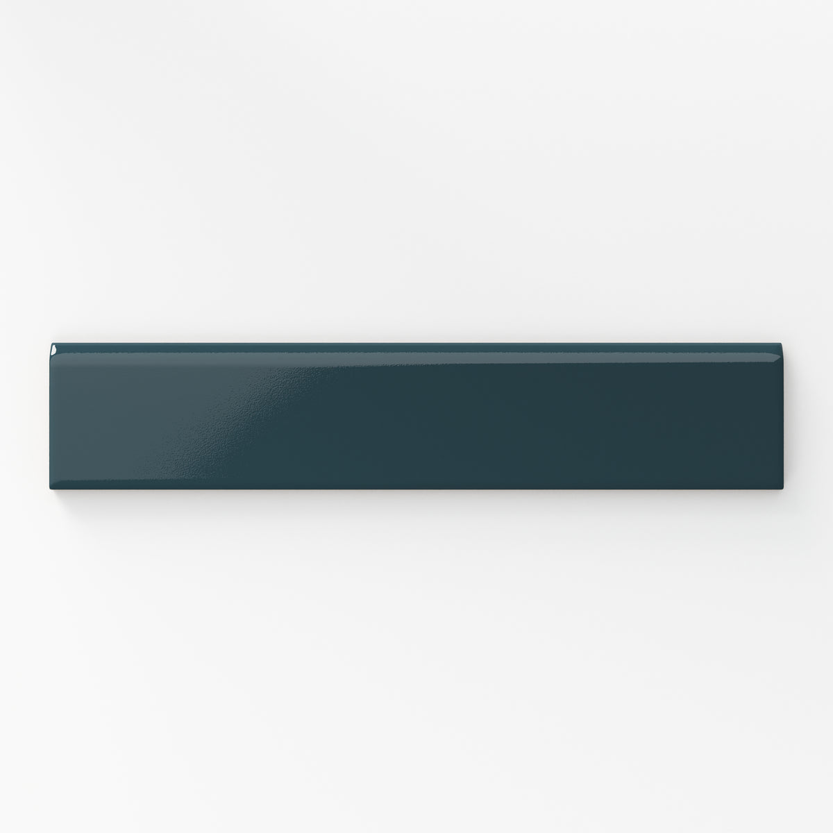 This rich blue 2x10 bullnose tile, finished with a sleek glossy surface, is an excellent choice for a modern and striking accent.