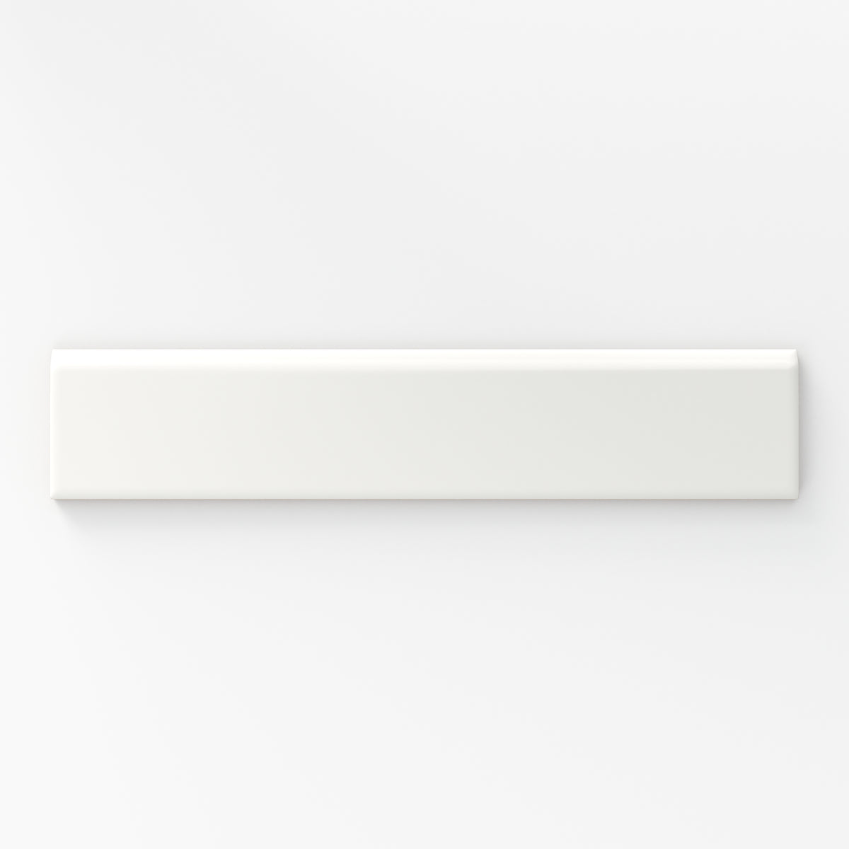 Matte white bullnose tile in a soft cloud shade, perfect for adding a smooth and refined edge to classic or modern designs.