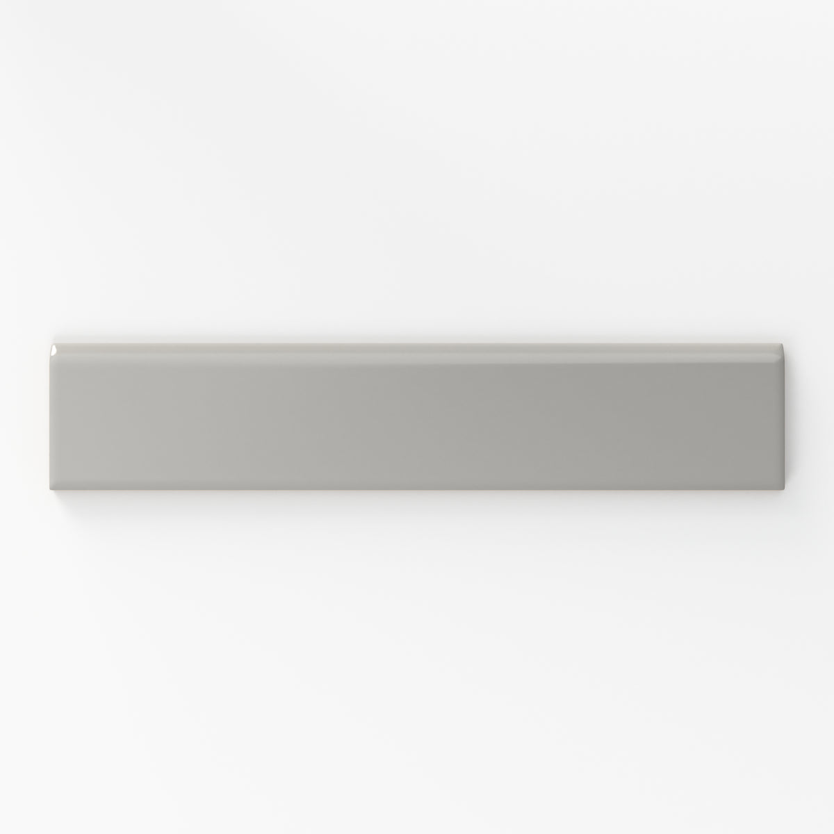 Matte taupe bullnose tile with a soft, neutral tone, perfect for adding a subtle and contemporary edge to interior designs.