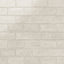 Glossy beige-colored ceramic subway tiles in a 3x6 format, featuring a soft, handmade texture for a timeless and elegant design