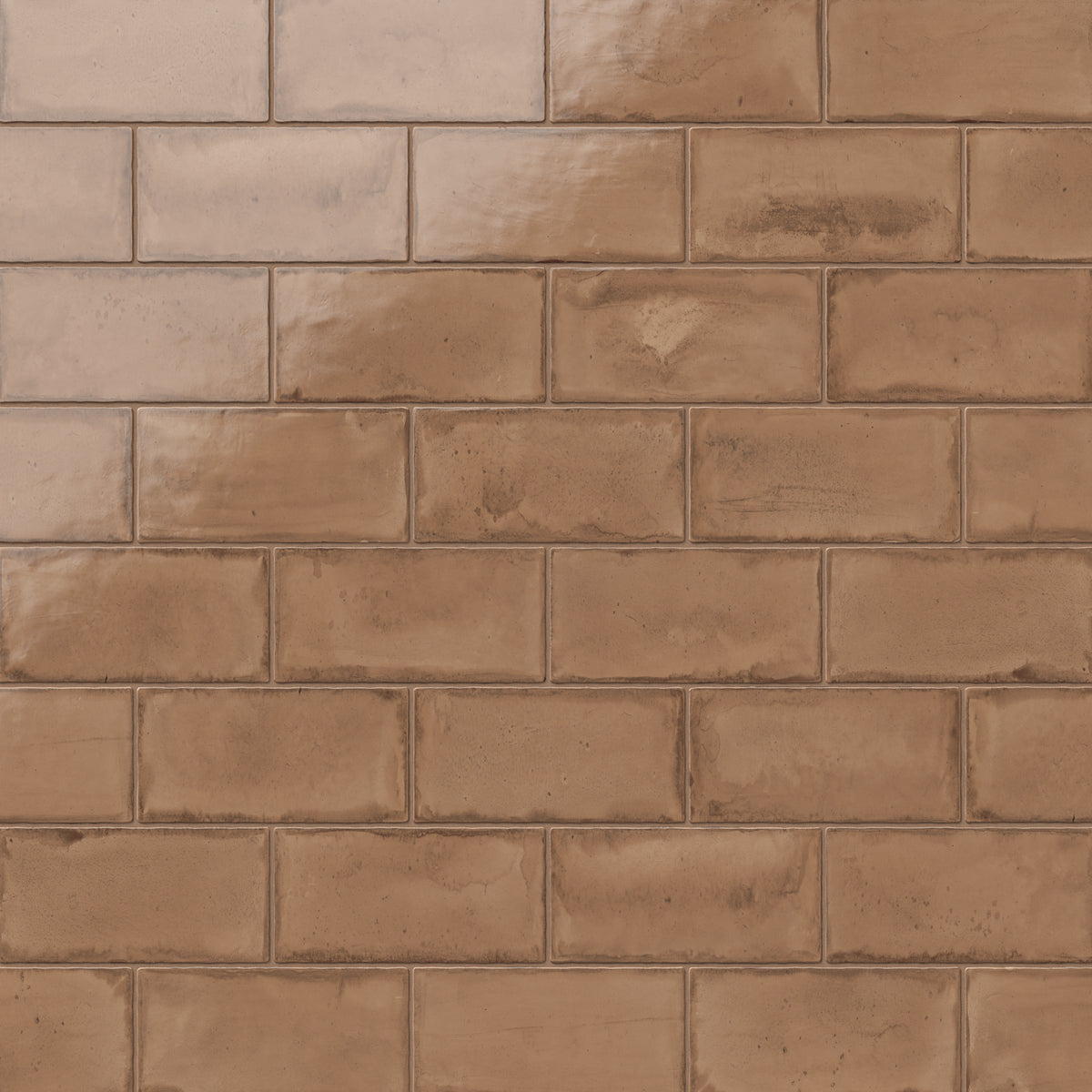 Rich brown glossy ceramic subway tiles in a 3x6 format, showcasing a warm, artisanal finish with subtle texture variations