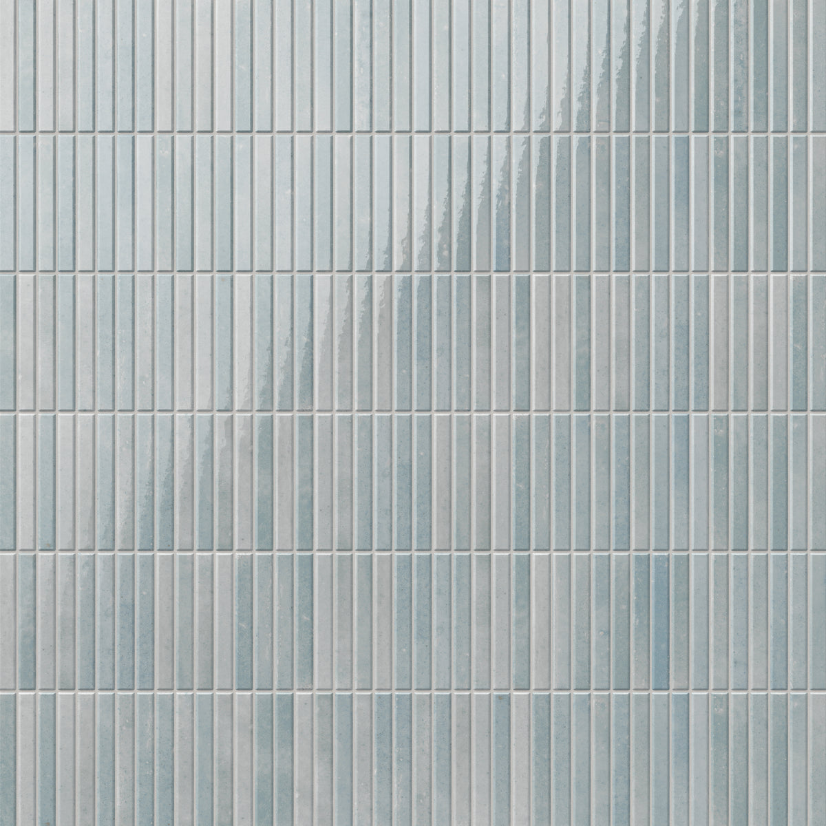 Elegant Miley porcelain tiles with subtle blue and light gray hues and a glossy finish, featuring vertical grooves for a modern and textured aesthetic