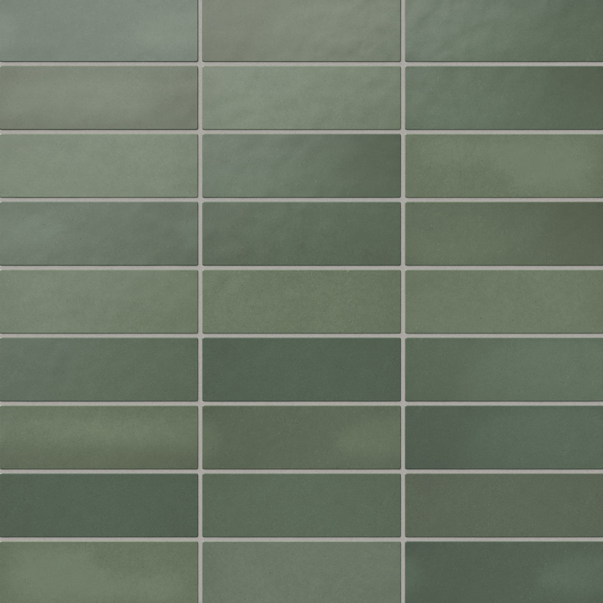Ellie matte ceramic subway tiles in rich forest green tones, offering a vibrant and natural aesthetic perfect for earthy interior designs