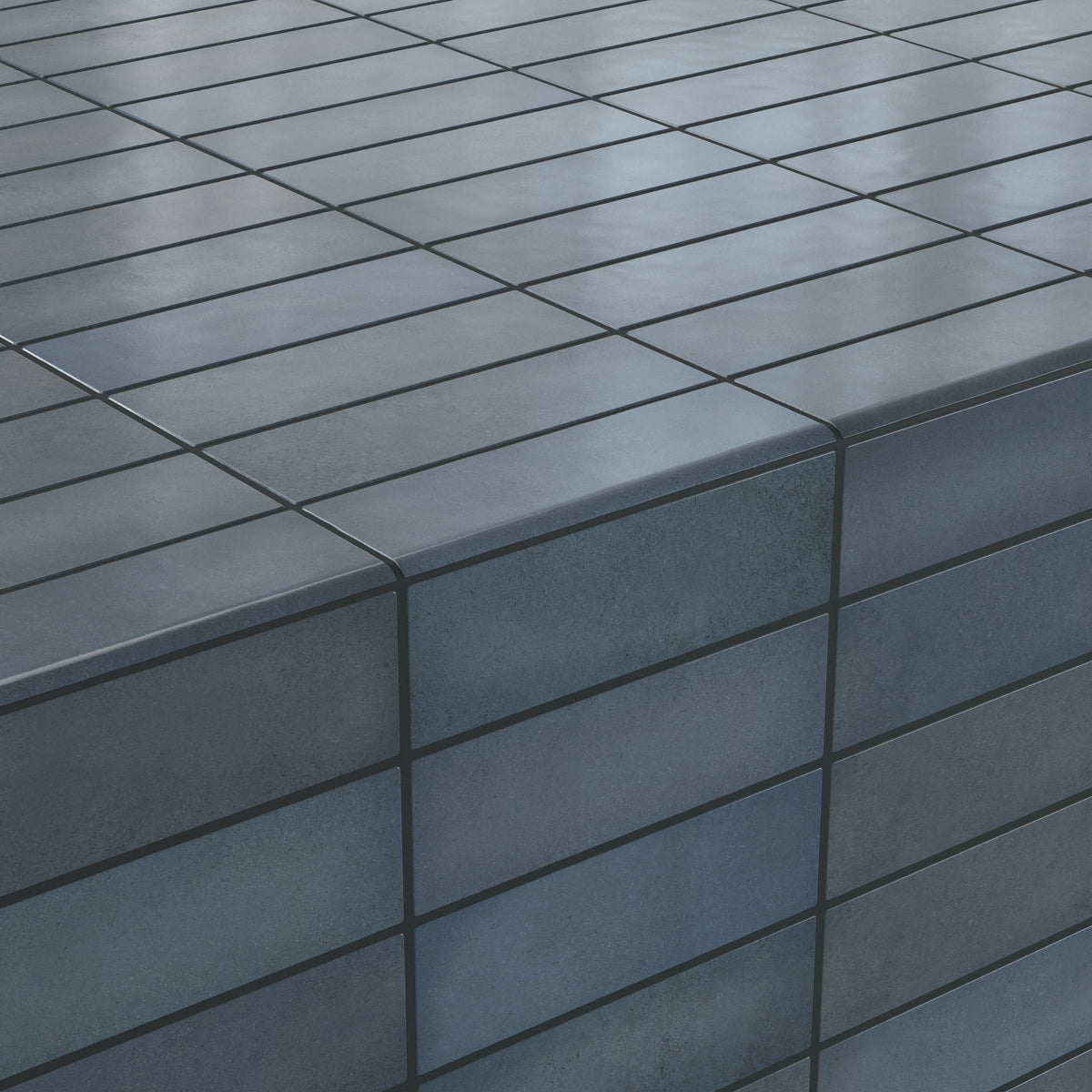 Chic denim-blue 2.5x8 matte tiles with sleek bullnose edges, creating a seamless and modern corner finish