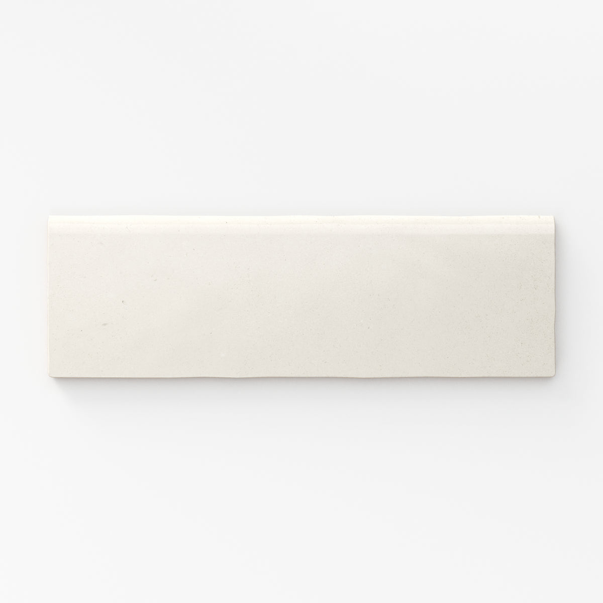 Soft eggshell-white matte tile with refined bullnose edges, perfect for minimalist elegance