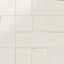 Soft white porcelain tiles featuring a glazed finish with worn accents that create a vintage, timeworn effect.