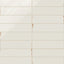 Subway porcelain tiles in soft white with a glossy surface and rustic brown edges.