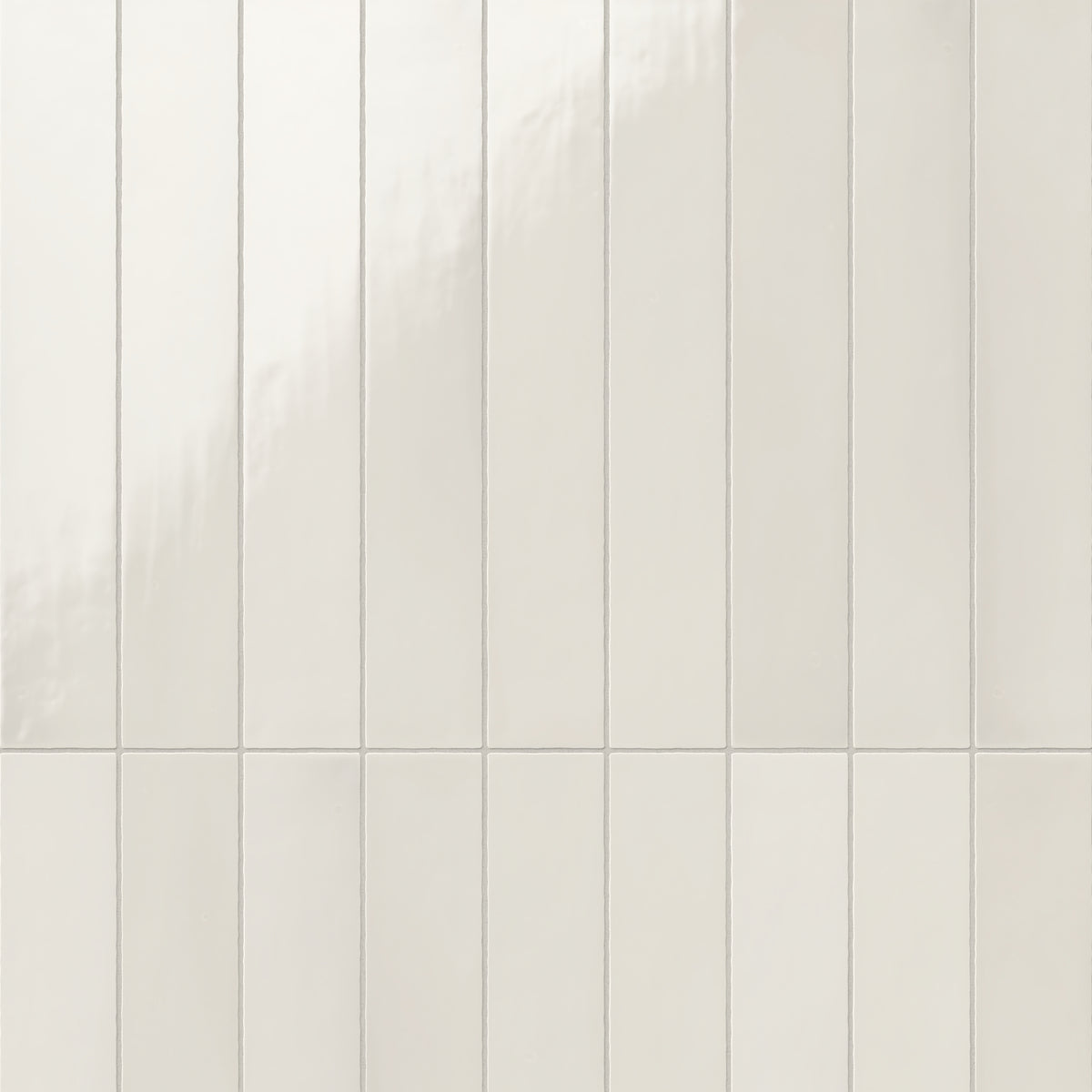 Glossy off-white ceramic subway tiles, aligned vertically for a clean and contemporary look