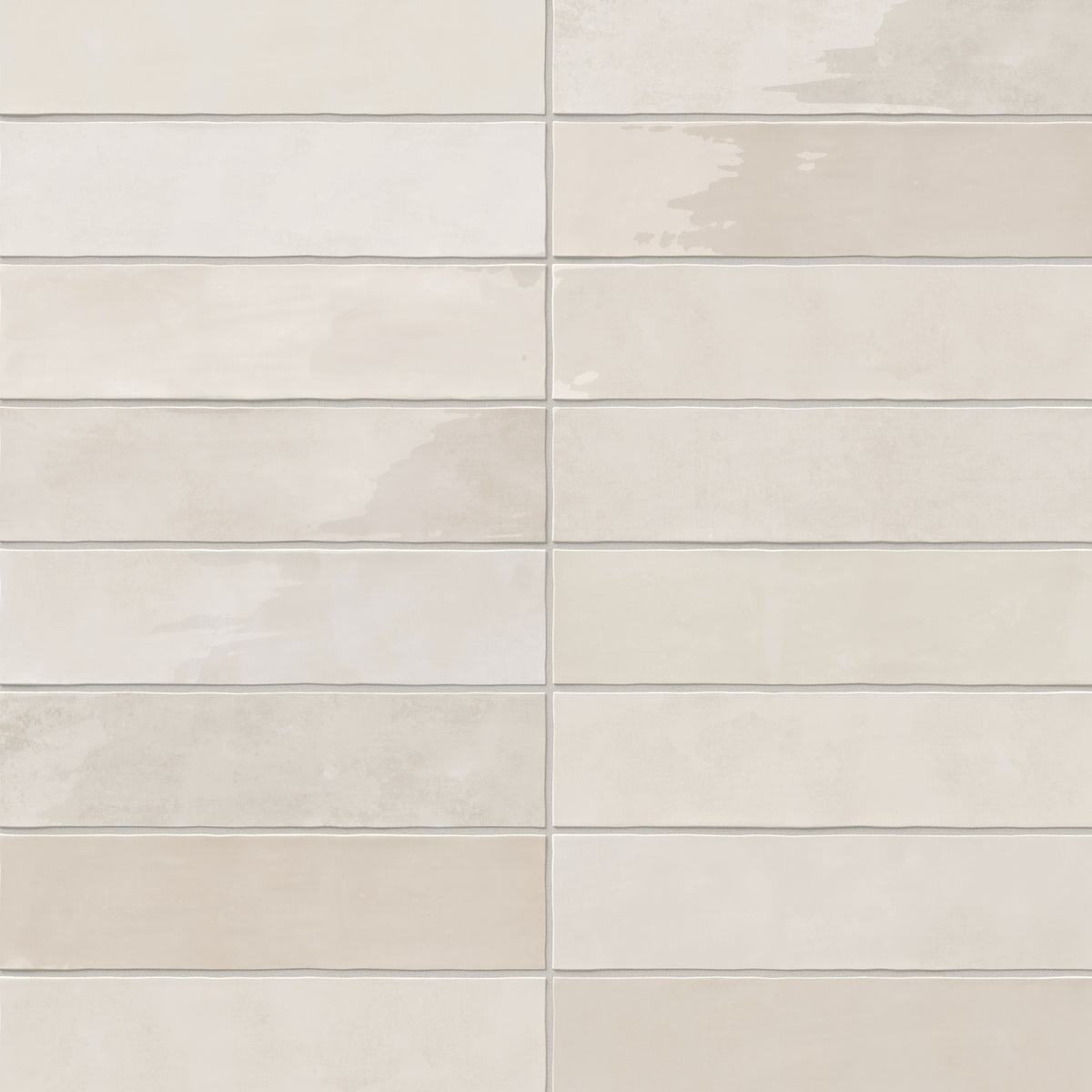 A 3x12 ceramic subway tile in off-white, featuring a glossy finish, and a clean stacked layout with fine grout lines.