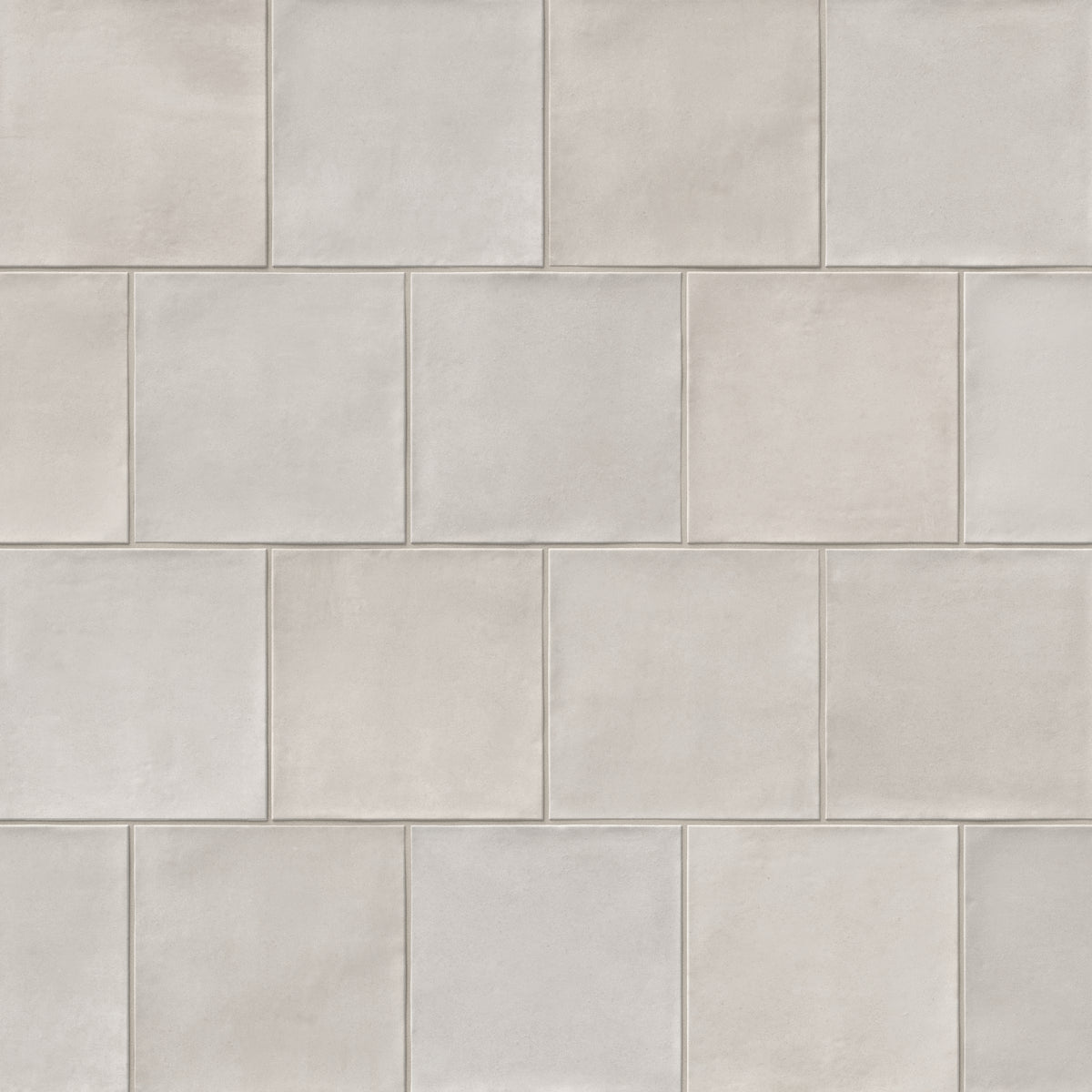 Karina 5.5x5.5 matte porcelain tile in Greige, combining soft taupe and warm grey tones in a handcrafted square layout for a clean, artisanal wall finish.