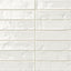 Glossy white 2x10 ceramic subway tile with a slightly textured, uneven surface that adds depth and handcrafted character to the finish.