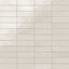 Glossy subway tiles in shifting white tones with an artisan-like surface and subtle reflective finish.
