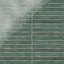 Rectangular porcelain wall tile in a glossy finish with a smooth, lightly textured surface, featuring a deep muted green color with soft natural variation.