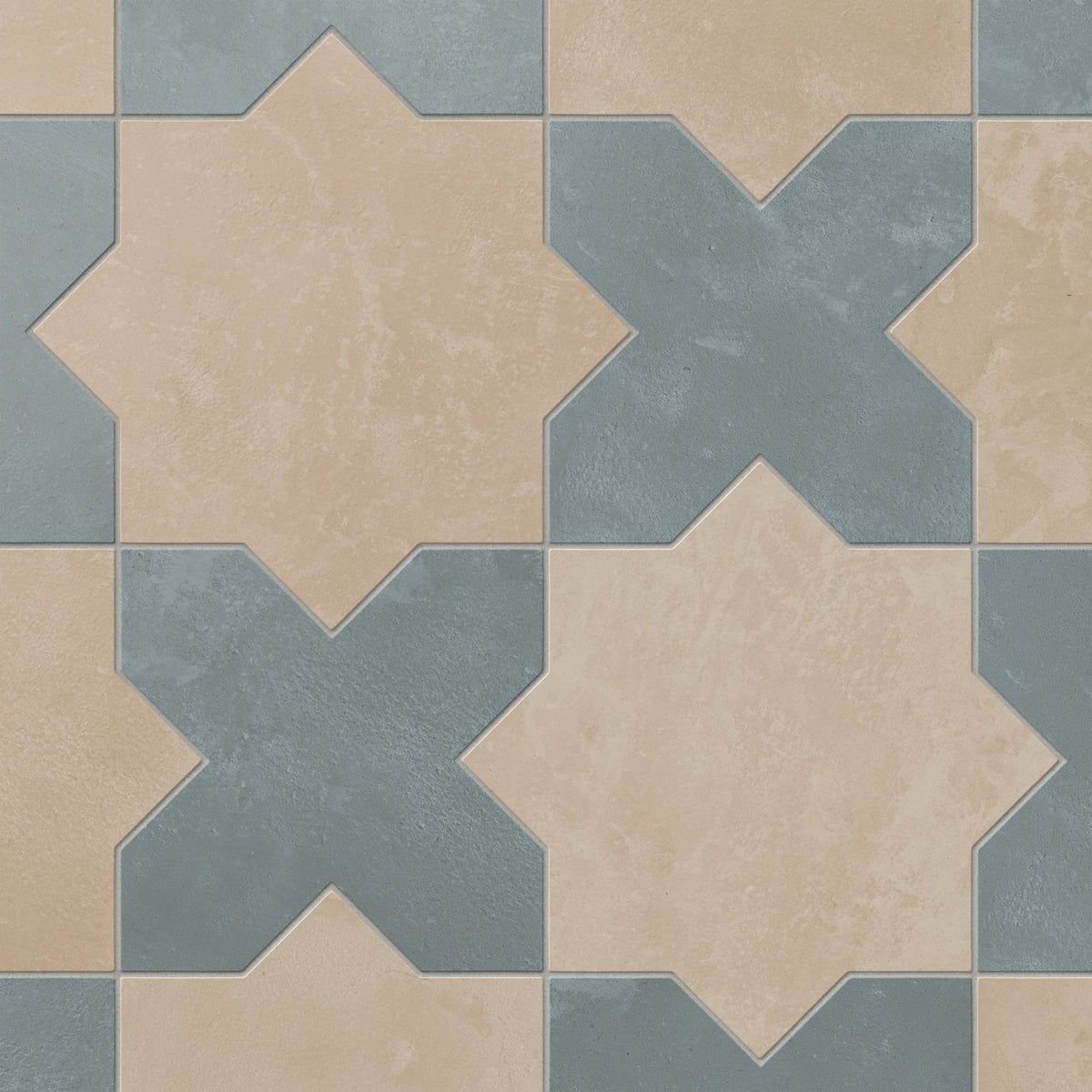 This matte porcelain tile pairs star and cross forms in alternating earth-drawn hues of light brown and blue, softened by cement-plaster texture and a handmade terracotta finish.