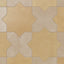 Yellow-orange star forms pair easily with light brown crosses on this porcelain tile, finished with a soft matte glaze and subtle cement-plaster texture that feels organic and gently time-worn.
