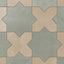 A repeating star and cross pattern brings muted sage green and light brown together on this porcelain tile, finished with a powdery matte surface and subtle cement-plaster texture reminiscent of handmade terracotta.