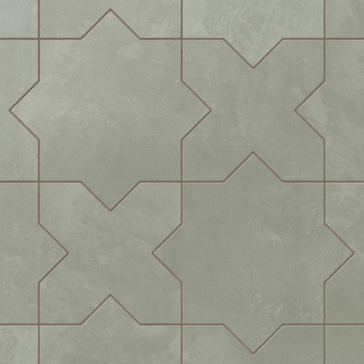 A sage green 11x11 matte porcelain tile shaped in star and cross forms, with a powdery glaze that brings a relaxed, handcrafted look to transitional bath spaces.