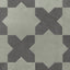Featuring star and cross shapes in alternating earth-drawn hues of muted sage green and dark gray, this matte porcelain tile has subtle cement-plaster texture and a powdery finish inspired by handmade terracotta.